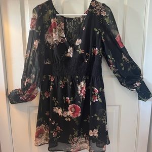 Floral and black cocktail dress with sheer sleeves and lace detail